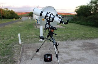 Image 8 – The author tested the mount with a 6.0-inch refractor powered with a 12-volt battery pack. The hand controller, the power cord, and the optional Celestron GPS unit are plugged into the side of the mount.